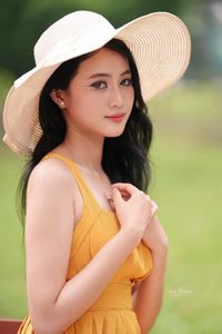 Charming Girl in Yellow Dress with Wide-Brim Hat Outdoors-3