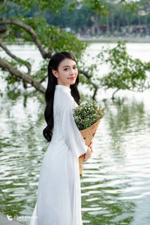 Gentle Vietnamese Woman in White Ao Dai by Hoan Kiem Lake | Serene Beauty of Vietnam-0