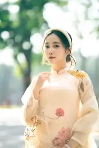 Graceful Vietnamese Beauty: Captivating Charm of a Girl in Elegant Traditional Attire-4