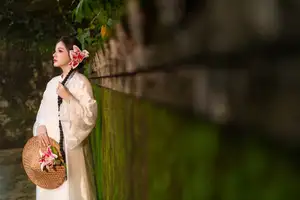 Captivating Asian Beauty: Discover the Ethereal Charm of a Maiden in White with a Blossom in Her Hair.-7