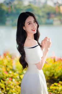 Radiant Beauty of a Vietnamese Girl with a Bright Smile in Nature-0