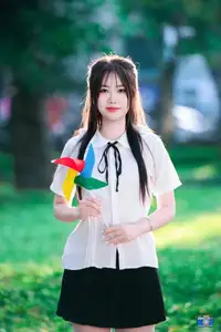 Radiant Youth: Vietnamese Girl's Bright Smile with Pinwheel in Golden Sunlight-4