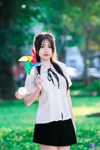 Radiant Youth: Vietnamese Girl's Bright Smile with Pinwheel in Golden Sunlight-8