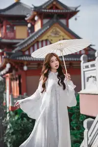 Explore Ethereal Asian Beauty: A Graceful Girl in White Ao Dai Amidst Ancient Oriental Charm-1