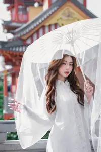 Explore Ethereal Asian Beauty: A Graceful Girl in White Ao Dai Amidst Ancient Oriental Charm-6