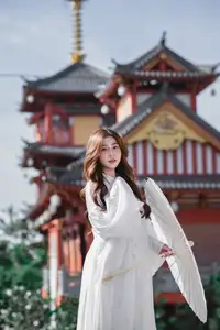 Explore Ethereal Asian Beauty: A Graceful Girl in White Ao Dai Amidst Ancient Oriental Charm-8