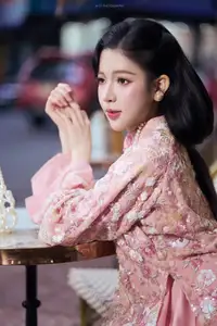 Graceful Pink Ao Dai Beauty: Elegant Vietnamese Woman with Alluring Pearl Jewelry-2