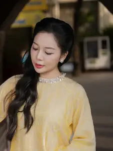 Graceful Vietnamese Beauty: Elegant Woman in Modern Traditional Attire Captures Asian Charm-3