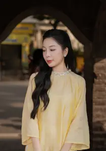 Graceful Vietnamese Beauty: Elegant Woman in Modern Traditional Attire Captures Asian Charm-0