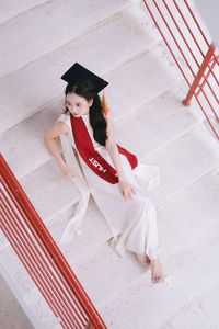 Beautiful Female Graduate Embraces Success at Graduation Ceremony-12