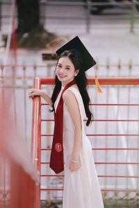 Beautiful Female Graduate Embraces Success at Graduation Ceremony-16