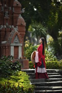 Traditional Vietnamese Beauty: Young woman with ancient instrument, immersed in culture and music.-7
