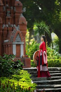Traditional Vietnamese Beauty: Young woman with ancient instrument, immersed in culture and music.-8