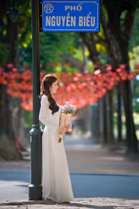 XVG No.55: Vietnamese Ao Dai Charm A Radiant Smile Embracing Youth and Tradition Under Golden Sun-10