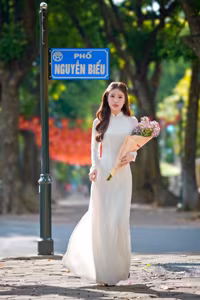 XVG No.55: Vietnamese Ao Dai Charm A Radiant Smile Embracing Youth and Tradition Under Golden Sun-5