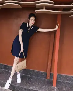 VGU No.181: Urban Muse Embraces Modern Elegance with Polo Dress and Chic Sneakers-4