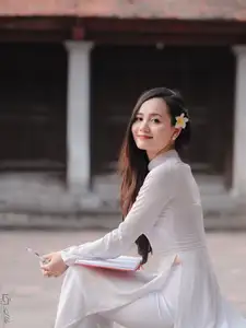Graceful Vietnamese Girl in White Ao Dai, Radiant Smile at Ancient Site 1000026917-9