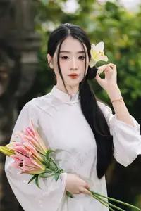 Discover the Grace of a Vietnamese Woman in White Ao Dai with Elegant Lilies-10