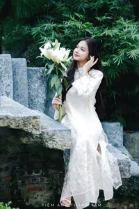 VGU No.131: Explore the Ethereal Beauty of a Vietnamese Lady in White Ao Dai with Lilies-6