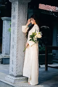 VGU No.131: Explore the Ethereal Beauty of a Vietnamese Lady in White Ao Dai with Lilies-12