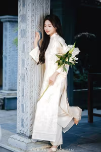 VGU No.131: Explore the Ethereal Beauty of a Vietnamese Lady in White Ao Dai with Lilies-0