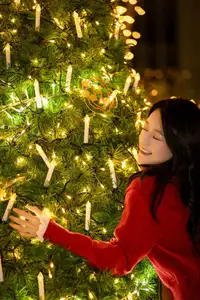 Radiant Smile Girl in Red Amidst Twinkling Lights: Warm Beauty for Festive Season-17