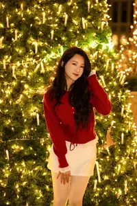 Radiant Smile Girl in Red Amidst Twinkling Lights: Warm Beauty for Festive Season-15