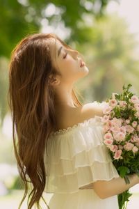 Gentle Beauty: Girl in Pristine White Dress with Pink Rose Bouquet Amidst Nature, Elegant Summer Style 1000019683-9