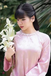 Gentle Youthful Beauty in Pink Silk Ao Dai-3