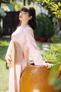 Gentle Youthful Beauty in Pink Silk Ao Dai-5