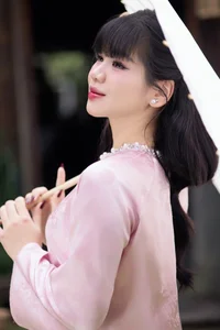 Gentle Youthful Beauty in Pink Silk Ao Dai-11