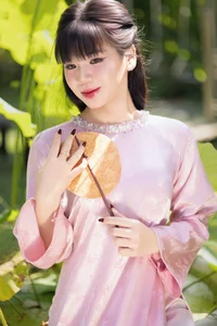 Gentle Youthful Beauty in Pink Silk Ao Dai-1