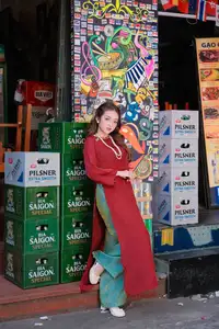Elegant Vietnamese Beauty: A Girl in Red Ao Dai with Lilies Captivates Urban Charm-3