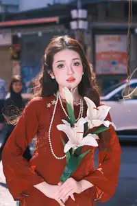 Elegant Vietnamese Beauty: A Girl in Red Ao Dai with Lilies Captivates Urban Charm-8