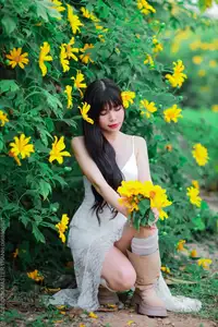 Graceful Young Woman in White Dress Amidst Vibrant Yellow Flowers 1000026997-6