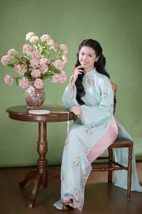 Radiant Elegance in Traditional Blue Attire and Spring Blooms-3