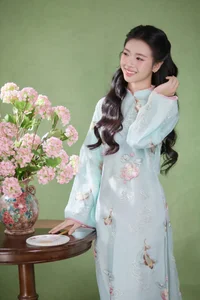 Radiant Elegance in Traditional Blue Attire and Spring Blooms-8