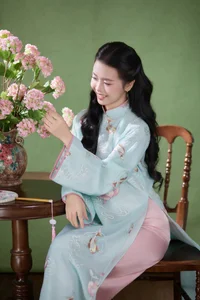 Radiant Elegance in Traditional Blue Attire and Spring Blooms-2