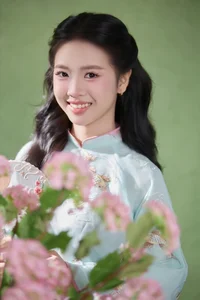 Radiant Elegance in Traditional Blue Attire and Spring Blooms-0