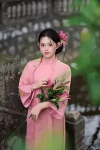 Elegant Pink Ao Dai Amidst Ancient Architecture Capturing Timeless Traditional Beauty-4