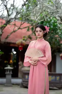 Elegant Pink Ao Dai Amidst Ancient Architecture Capturing Timeless Traditional Beauty-3