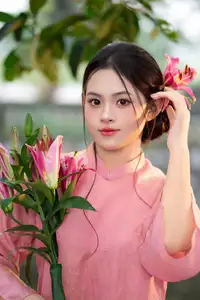 Elegant Pink Ao Dai Amidst Ancient Architecture Capturing Timeless Traditional Beauty-0