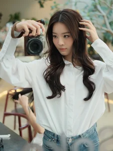 Karen Nguyen radiates effortless elegance in a classic white shirt minimalist look-5