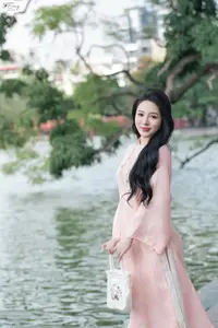 Discover the Elegant Charm of Vietnamese Beauty in a Pink Ao Dai by the Serene Lake-0