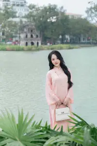 Discover the Elegant Charm of Vietnamese Beauty in a Pink Ao Dai by the Serene Lake-6