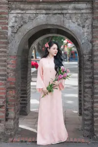 Discover the Elegant Charm of Vietnamese Beauty in a Pink Ao Dai by the Serene Lake-7