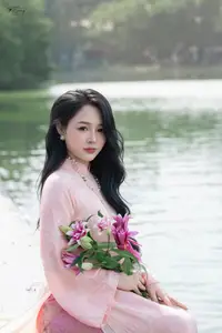 Discover the Elegant Charm of Vietnamese Beauty in a Pink Ao Dai by the Serene Lake-4