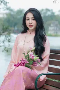 Discover the Elegant Charm of Vietnamese Beauty in a Pink Ao Dai by the Serene Lake-1