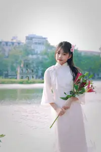 Graceful Vietnamese Girl in White Ao Dai Shines with Traditional Beauty in Old Quarter-8