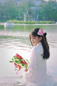 Graceful Vietnamese Girl in White Ao Dai Shines with Traditional Beauty in Old Quarter-1